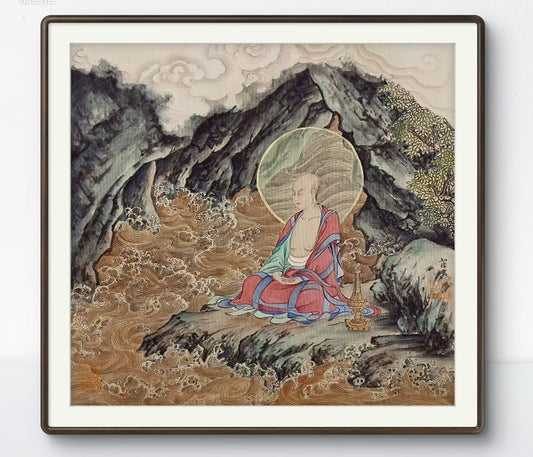 Framed artwork of a seated Buddha with a mountainous landscape