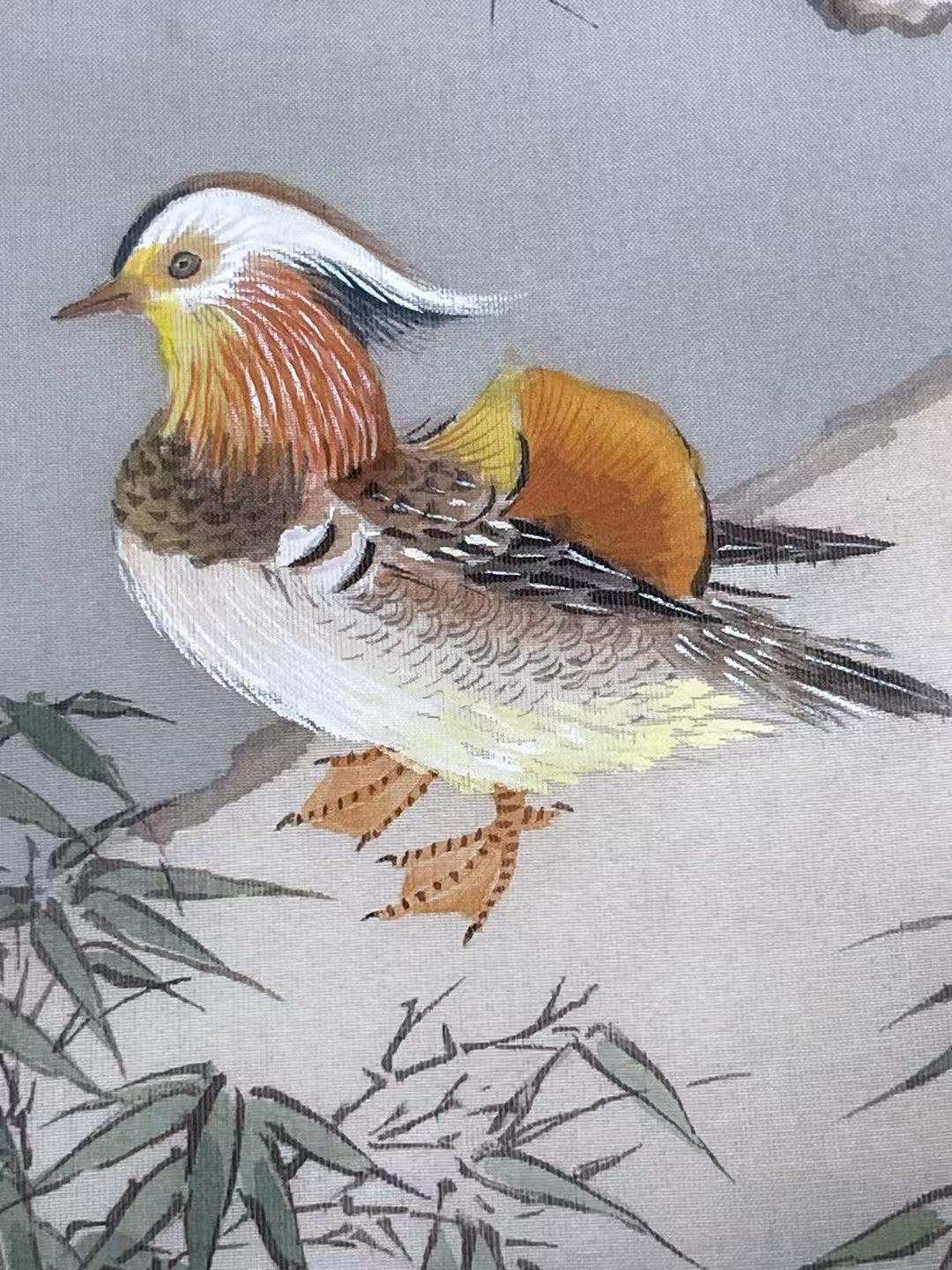 Colorful bird illustration on a textured fabric background